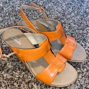 Never worn Clarks Orange Wedges